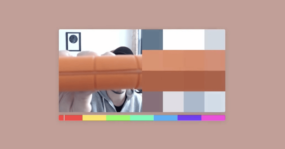 A screenshot of a website. on the left is a camera feed and a person (me) holding an orange shape right in front of the camera. On the right is a very low res 4x4 grid of colors replicating the video next to it. Beneath it is a color spectrum indicating a position that moves on the spectrum. In this work, the color you hold in front of your camera, changes the chords of an arpeggiator.